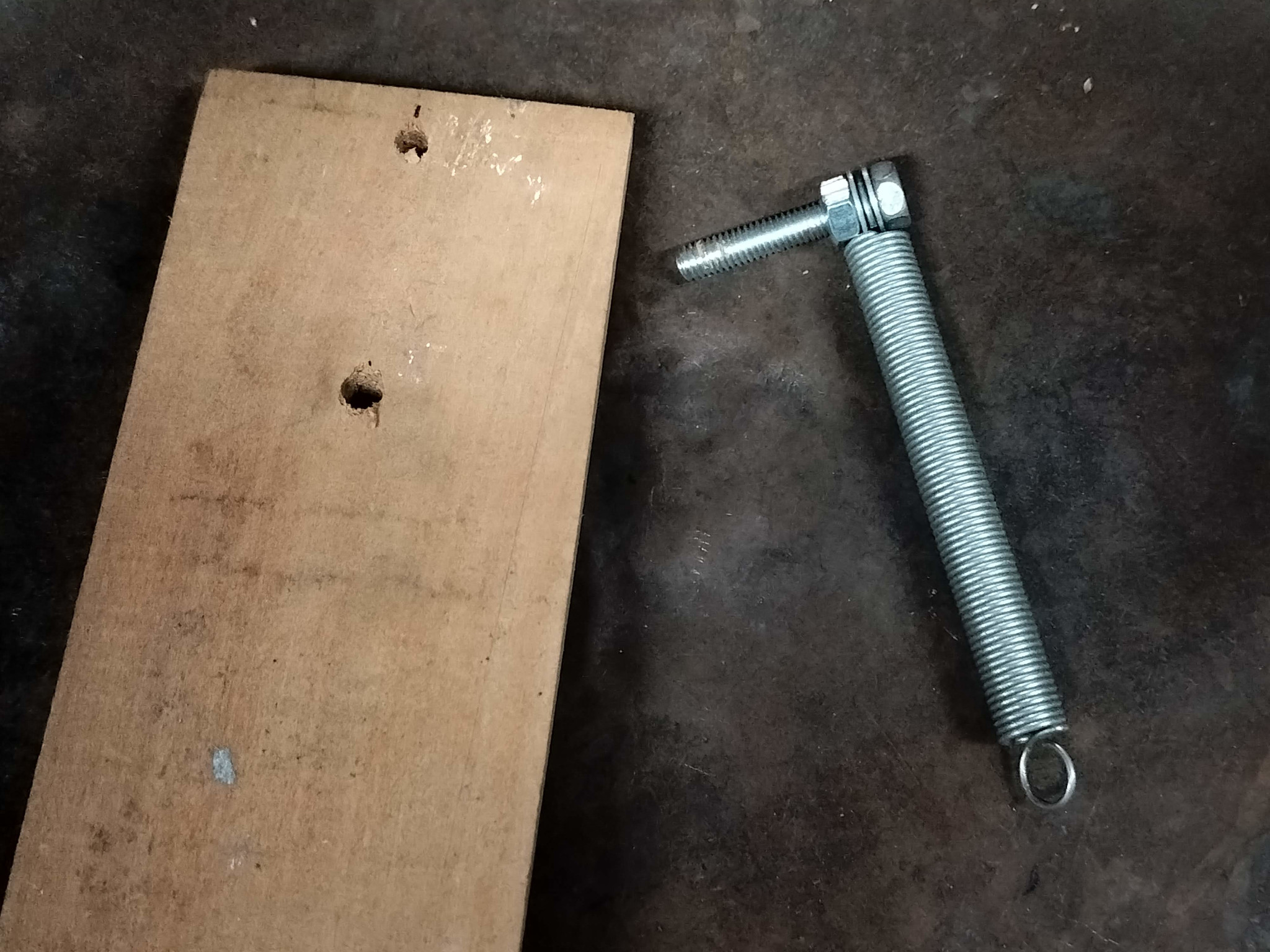 Wooden slab and spring + bolt
